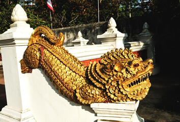     gold lion statue in a temple of Thailand