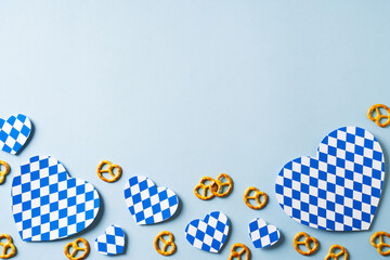 Oktoberfest backdrop with blue traditional print hearts on blue background