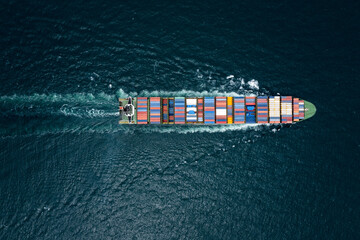 container cargo ship sailing full speed in pacific ocean to transport goods import export...