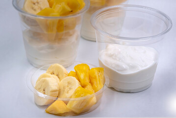 Bowl of fresh yogurt with fruit served for good health.