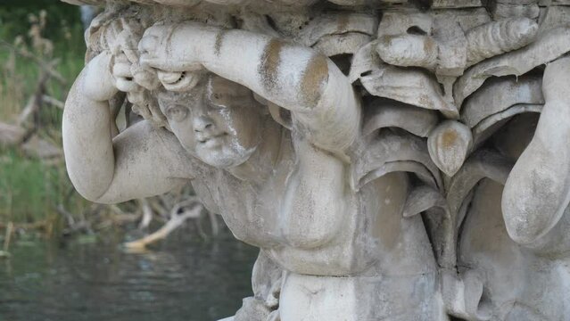 A close up view of a statue by a river.
