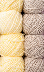 pastel colored yarn wool on shopfront. Knitting background, a lot of balls. Knitting yarn for handmade winter clothes