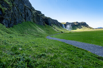 Fototapeta na wymiar A beautiful view of the Seljalandsfoss waterfall in Iceland under a cloudy sky