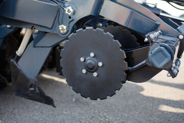 part of the metal mechanism of the machine for working in the fields close up outdoor portrait. combine or tractor parts  with applied marks on background