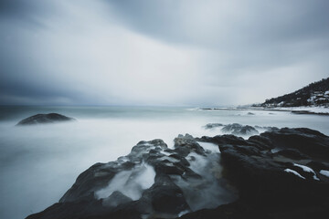 LONG EXPOSURE ON THE BEACH IN A BLACK SEA WAVY AND COLD WINTER DAY