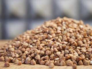 Pile of buckwheat, side view. Buckwheat macro. Buckwheat for porridge.