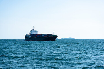 cargo ship with cargo containers in the Gulf of Thailand