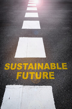 Sustainable future word on asphalt road surface with marking lines. Inspiration and motivation concept and business responsible effort idea