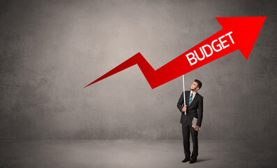 Young business person in casual holding road sign