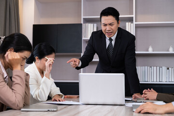 Asian men manager scold and angry with their employee inside of office meeting room with upset and...