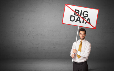 Fototapeta premium business person holding a traffic sign