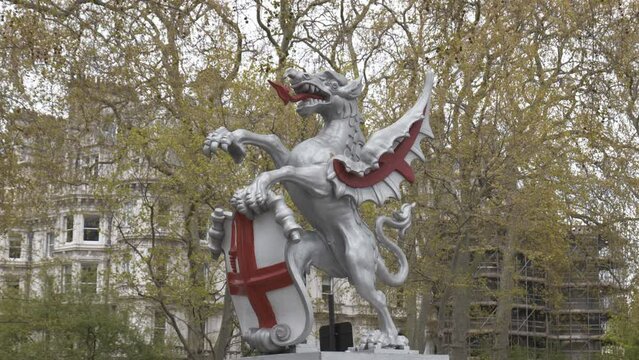 A statue of a silver dragon - the coats of arms of the city of London.