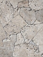 Fototapeta premium background of carved stones from the seabed with marks a, holes of the seabed of gray color