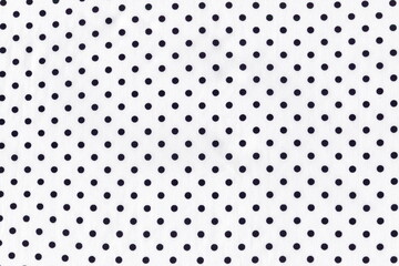 Light white silk fabric with small dark blue polka dots. Background of natural white silk fabric. Summer lightweight material. © Natalya