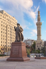 CAIRO, EGYPT - DECEMBER 29, 2021: Omar Makram Statue near Omar Makram Mosque on Tahrir square in Cairo, Egypt