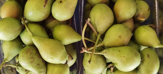 Yellow green pears on top of each other