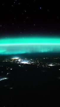 Aurora borealis light planet earth view from space vertical video for social media based on image by Nasa
