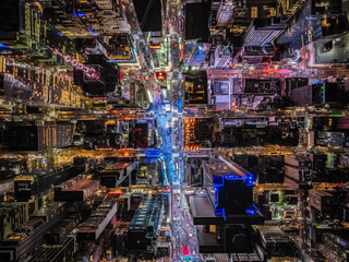 Night life in modern metropolis. Birds eye shot of high rise buildings and streets. Large display...