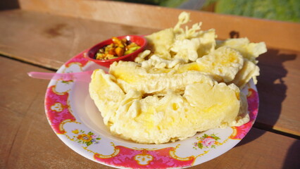 Indonesian traditional snacks Pisang Goreng and Tempe Goreng served on a plate. Made from the basic ingredients of Tempe and Banana and fried using flour