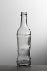 Silhouette of old transparent glass bottle on white background