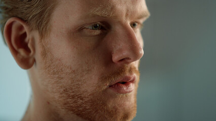 Focused man reading online blog closeup. Serious student learn interesting info
