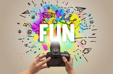 Close-up of a hand holding digital camera with abstract drawing