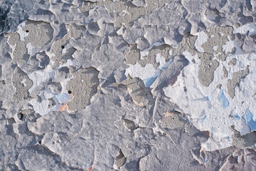 Cracked old paint on wall. wall texture background with peeling old paint. Abstract background of paint chipping off of a wall. Old painted wall texture grunge background