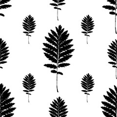 Seamless vector pattern with black leaves of different sizes on a white background. Texture for bed linen, wallpapers, tiles, clothes, tablecloths