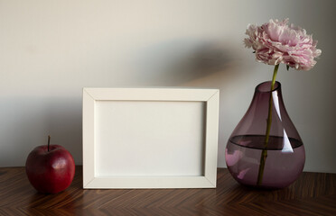 frame with space for text, decoration with a vase of flowers and fruit