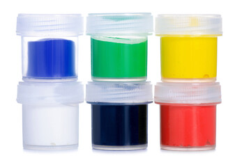 Jars gouache paints on white background isolation