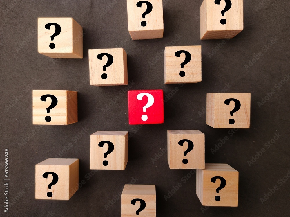 Poster top view of wooden cubes with question mark icons-concept of questions and answers