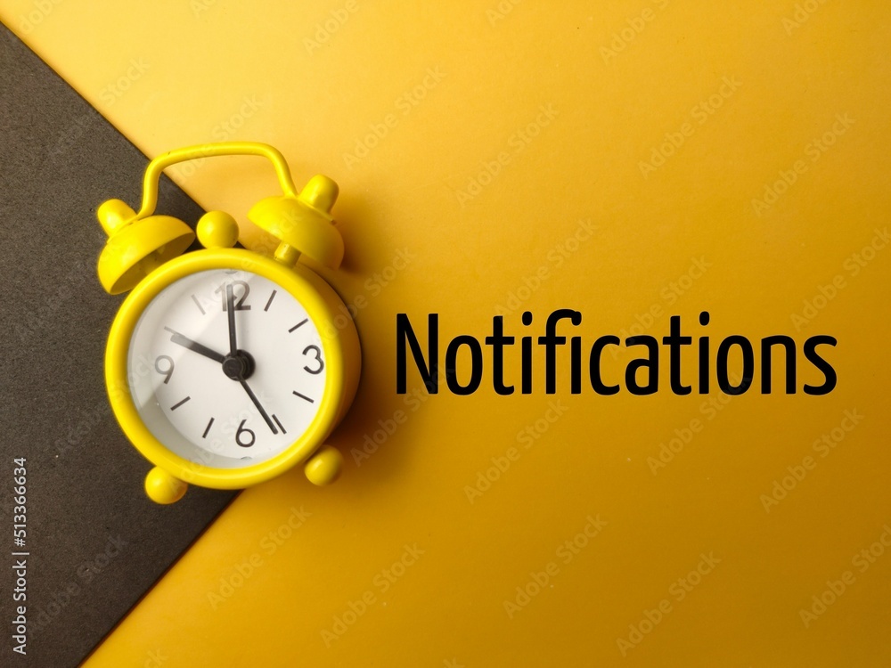 Poster top view of the alarm clock and the word notifications on yellow background
