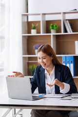 Happy excited young Asian woman with a laptop at home sitting in-home office, Emotional girl feeling glad and happy 