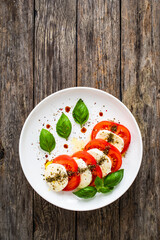 Caprese salad on wooden board
