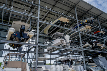 Naklejka premium Speed motor boats are stapled in a garage system in the marina
