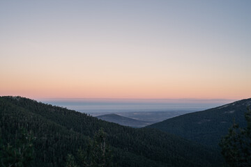 Foggy valley at dawn, with beautiful tones in the clear sky