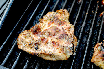 Grilling Chicken on a Gas Grill Close-Up
