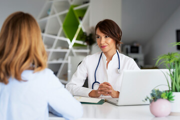 Female doctor consulting with her patient at the doctor's office