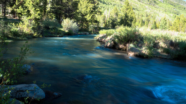 Smooth water on the Snake River in White River National Forest in Colorado