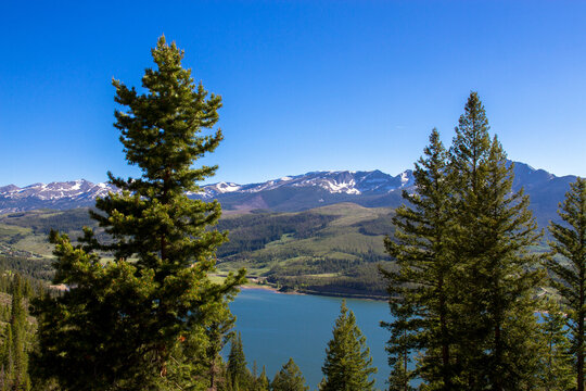 High-elevation view of the Colorado Rockies from across Dillon Reservoir at dawn in spring
