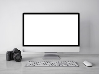 3d rendering mock up template of blank white screen of computer.Camera on the left side of the screen.Minimally designed room in gray and white tones