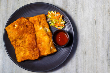 selective focus of delicious Indian food Mughlai Paratha is ready to eat.