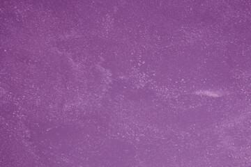 Abstract background of old purple plaster.