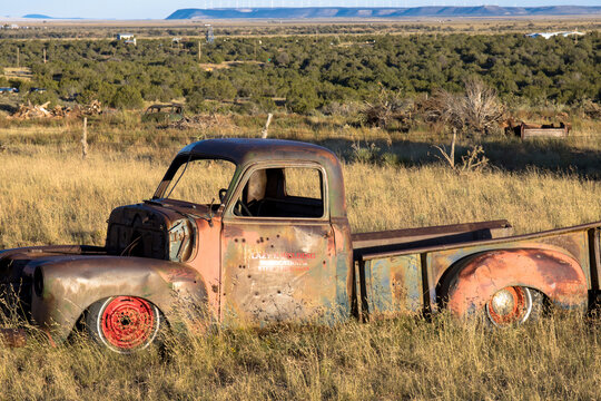Abandoned truck at sunset in a field in rural New Mexico
