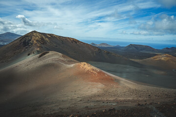 black volcanic landscape and mountains in national park timanfaya on lanzarote