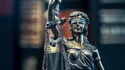 Fototapeta na wymiar Legal and law concept statue of Lady Justice on books background