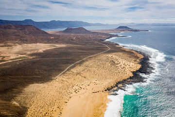 aerial view on volcanic landscape island at coast at Playa de las Conchas © Denis Feldmann