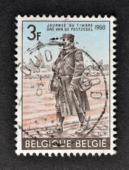 Cancelled postage stamp printed by Belgium, that shows Postman of the Field Post (1916), circa 1968.