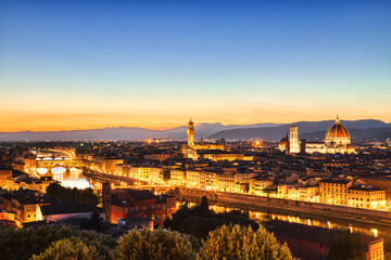 Fototapeta na wymiar Florence Aerial View at Golden Sunset over Ponte Vecchio Bridge, Palazzo Vecchio and Cathedral of Santa Maria del Fiore with Duomo