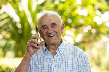 senior man talking on mobile or cell phone